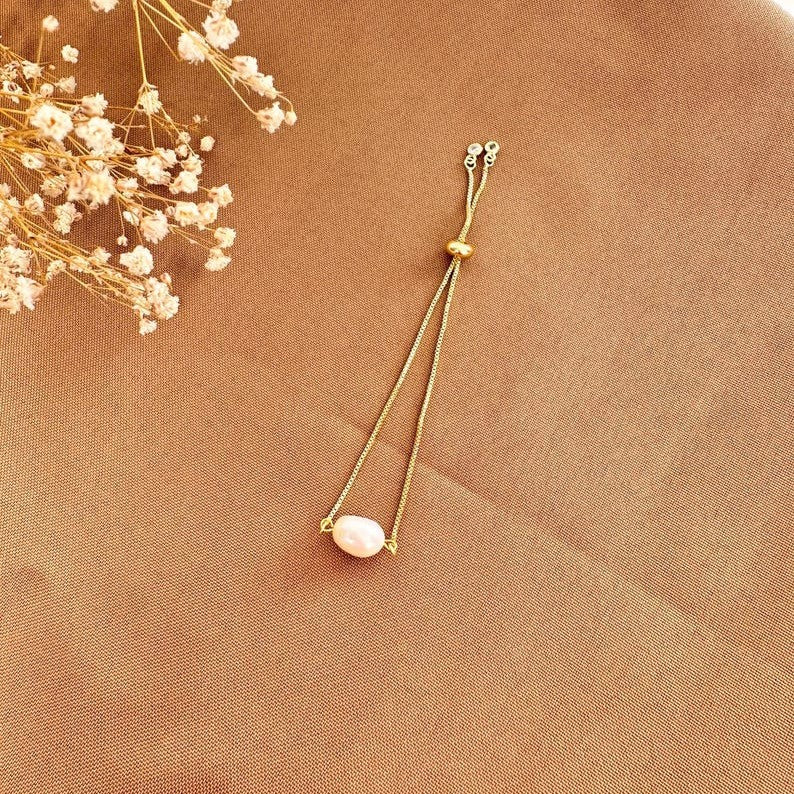 Pulsera ajustable con perla