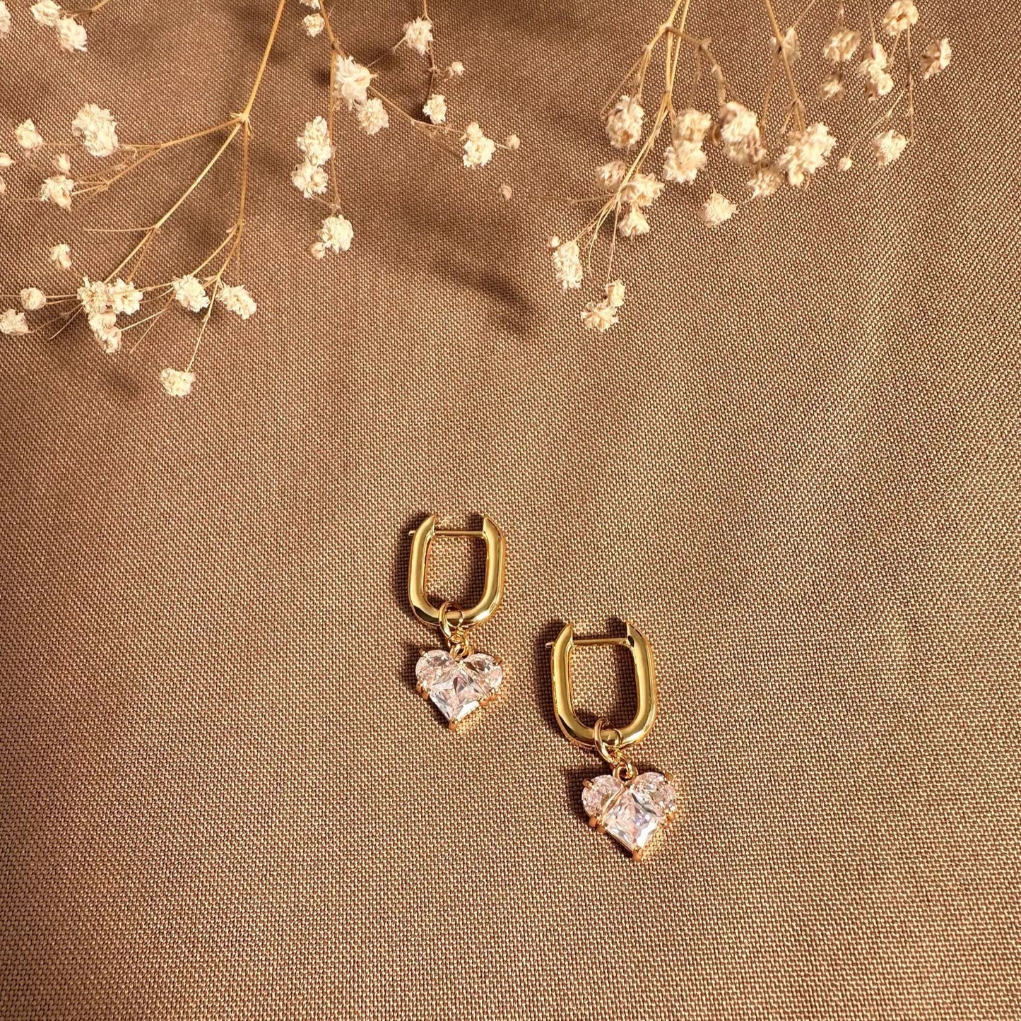 Aretes transformables corazones rosas