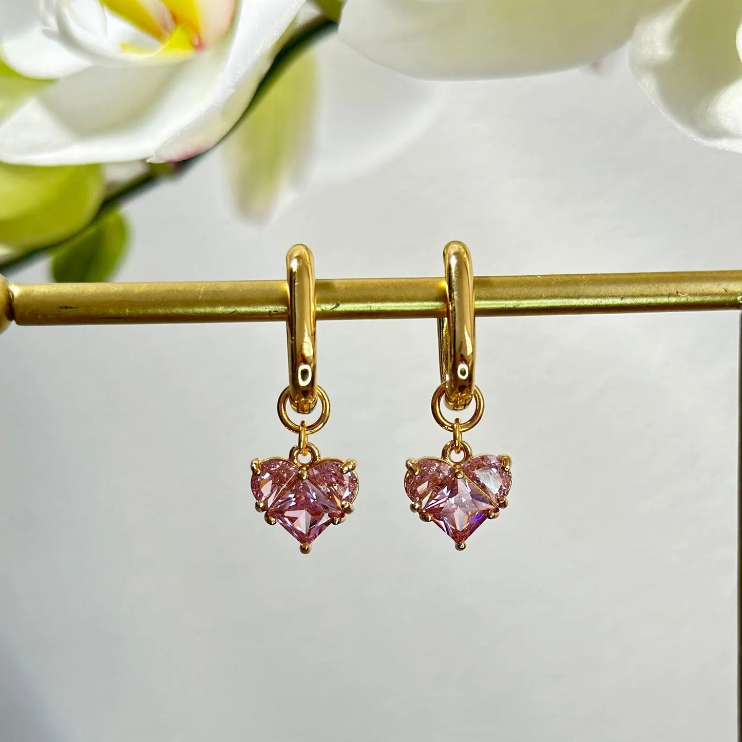 Aretes transformables corazones rosas